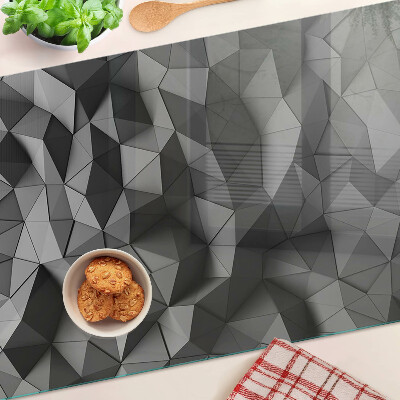 Tagliere in vetro con motivo geometrico astratto nei toni del grigio
