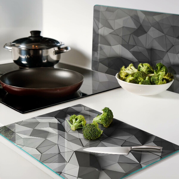 Tagliere in vetro con motivo geometrico astratto nei toni del grigio