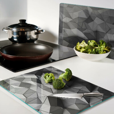 Tagliere in vetro con motivo geometrico astratto nei toni del grigio