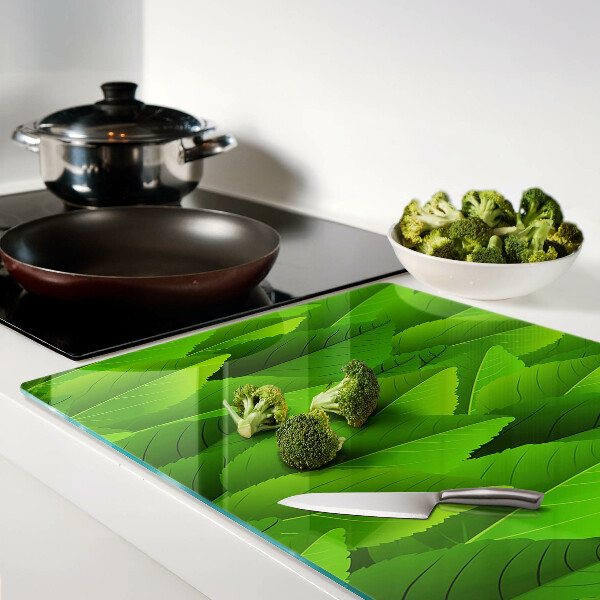 Tagliere in vetro temperato con motivo di foglie nei toni del verde