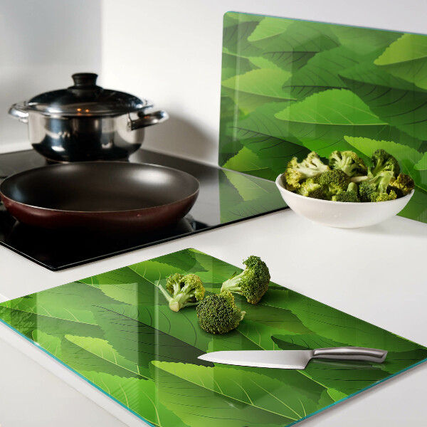 Tagliere in vetro temperato con motivo di foglie nei toni del verde