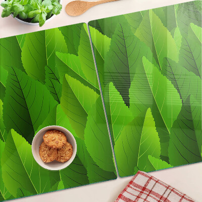 Tagliere in vetro temperato con motivo di foglie nei toni del verde