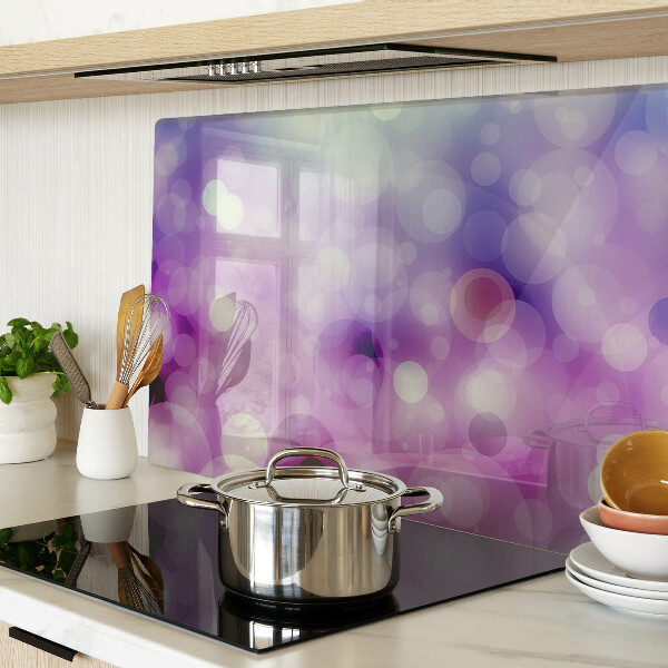 Tagliere in vetro con motivo bokeh nei toni del viola e del rosa