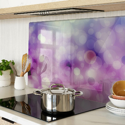 Tagliere in vetro con motivo bokeh nei toni del viola e del rosa