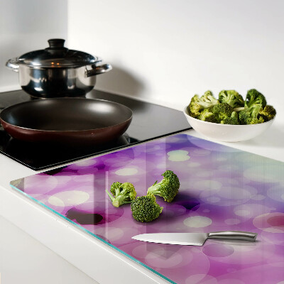 Tagliere in vetro con motivo bokeh nei toni del viola e del rosa