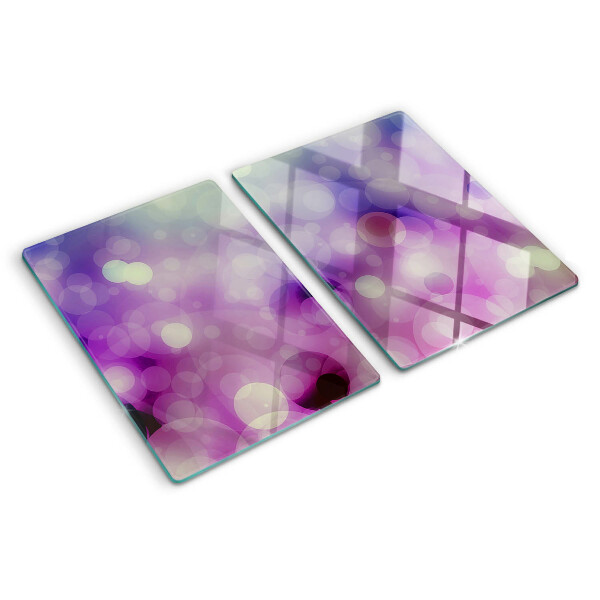 Tagliere in vetro con motivo bokeh nei toni del viola e del rosa