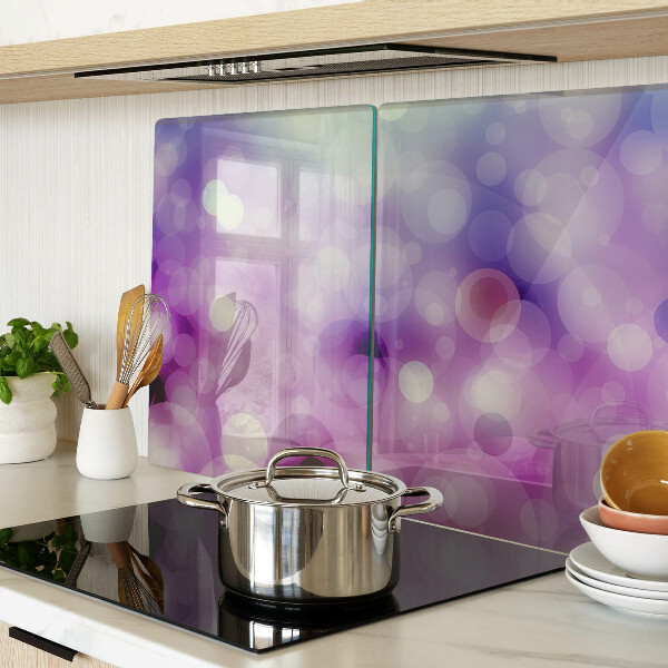Tagliere in vetro con motivo bokeh nei toni del viola e del rosa