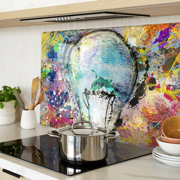 Tagliere in vetro temperato con stampa di una lampadina su sfondo colorato