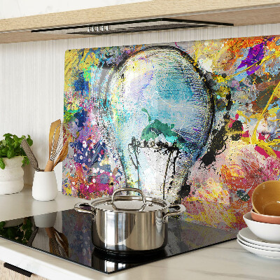 Tagliere in vetro temperato con stampa di una lampadina su sfondo colorato