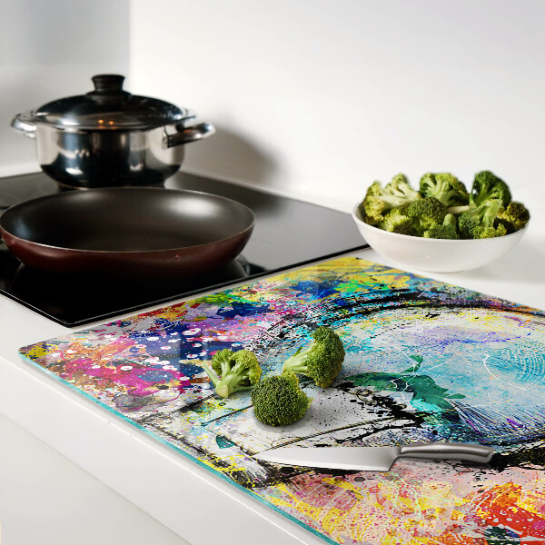 Tagliere in vetro temperato con stampa di una lampadina su sfondo colorato