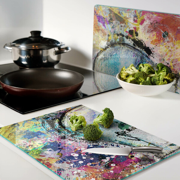 Tagliere in vetro temperato con stampa di una lampadina su sfondo colorato