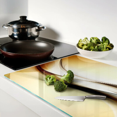 Tagliere in vetro temperato con motivo a onde astratte nei toni del beige