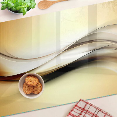 Tagliere in vetro temperato con motivo a onde astratte nei toni del beige