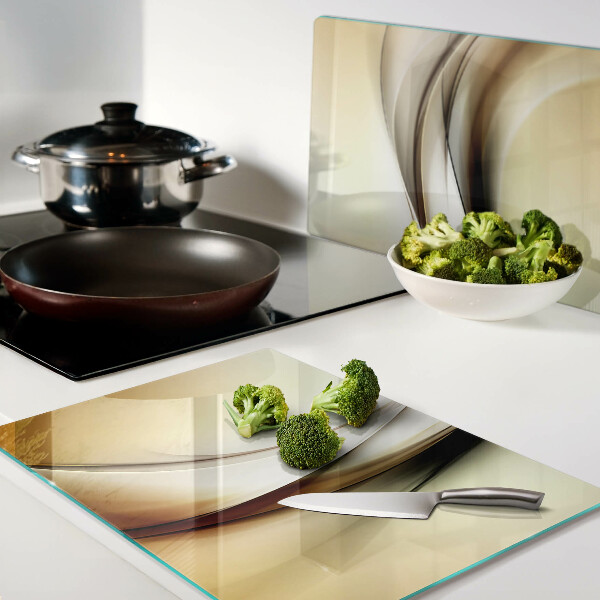 Tagliere in vetro temperato con motivo a onde astratte nei toni del beige