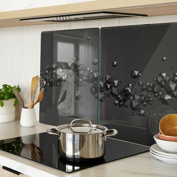 Tagliere in vetro con motivo a cristalli neri sullo sfondo