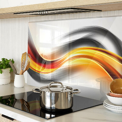 Tagliere in vetro temperato con motivo a onde nei toni dell'arancione e del nero