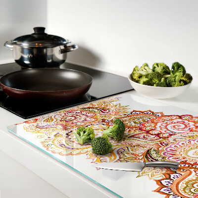 Tagliere in vetro con motivo paisley nei toni del rosso e dell'oro