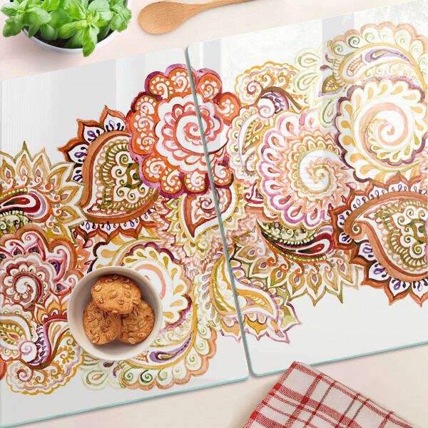 Tagliere in vetro con motivo paisley nei toni del rosso e dell'oro