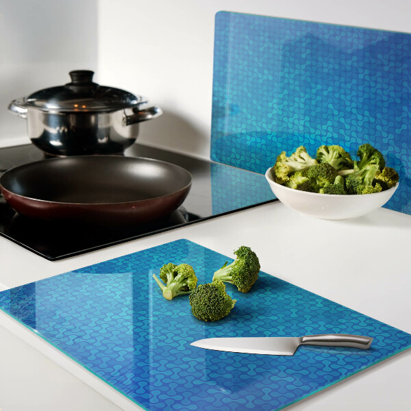 Tagliere in vetro temperato con motivo ondulato nei toni del blu