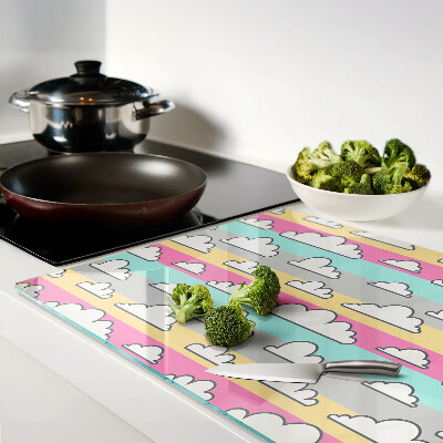 Tagliere in vetro temperato con motivo di nuvole su sfondo pastello