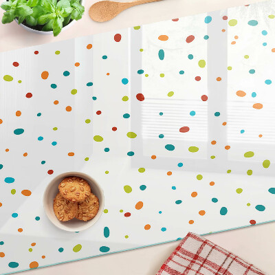 Tagliere in vetro temperato con punti colorati su sfondo bianco