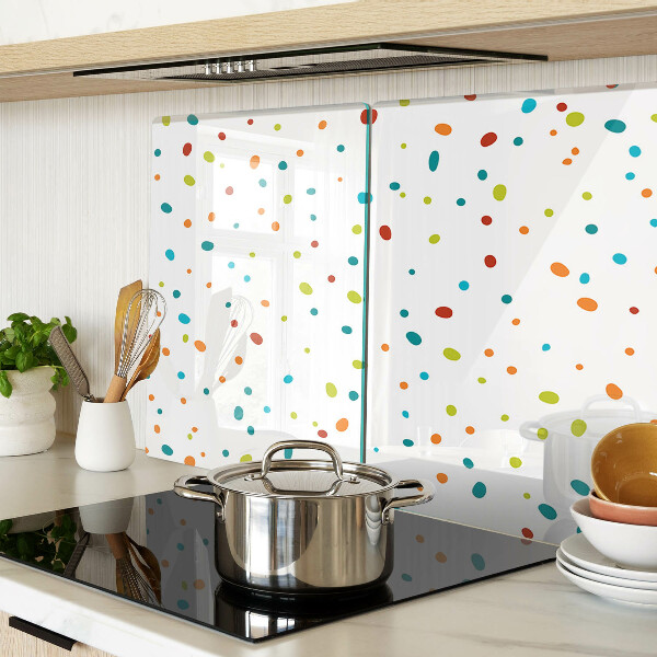 Tagliere in vetro temperato con punti colorati su sfondo bianco