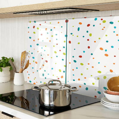 Tagliere in vetro temperato con punti colorati su sfondo bianco