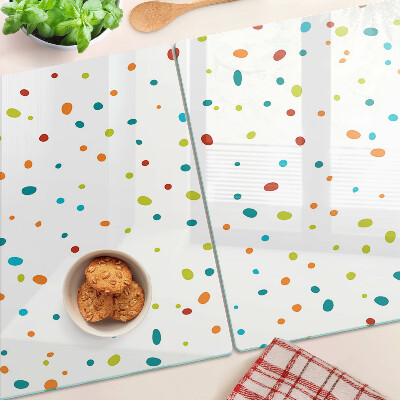 Tagliere in vetro temperato con punti colorati su sfondo bianco