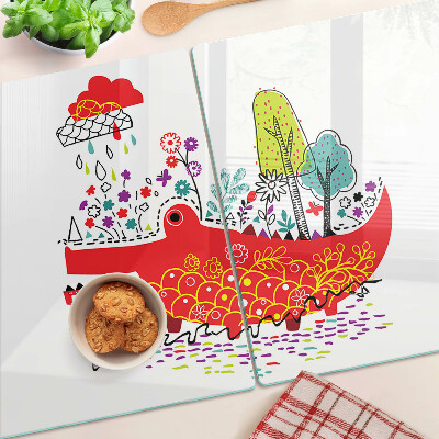 Tagliere in vetro con decoro a coccodrillo in una scena colorata