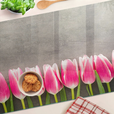 Tagliere in vetro con decorazione di tulipani su sfondo grigio