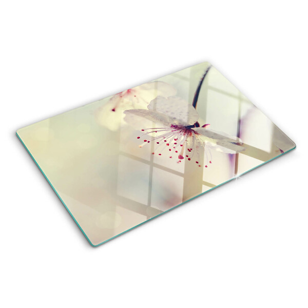 Tagliere in vetro temperato con motivo floreale su sfondo geometrico