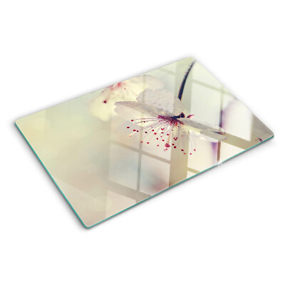 Tagliere in vetro temperato con motivo floreale su sfondo geometrico
