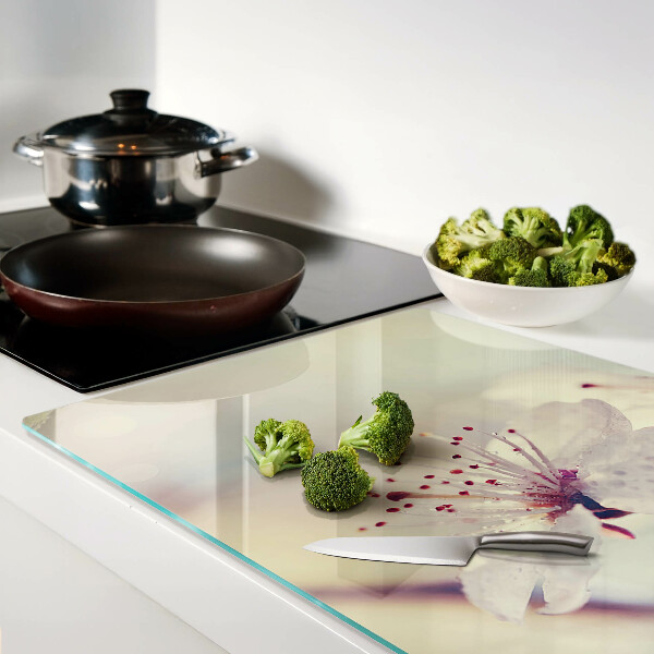 Tagliere in vetro temperato con motivo floreale su sfondo geometrico