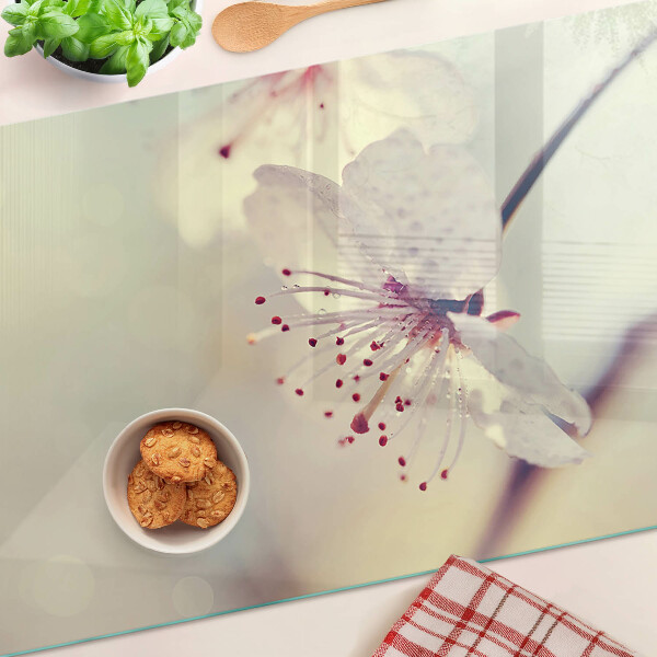 Tagliere in vetro temperato con motivo floreale su sfondo geometrico