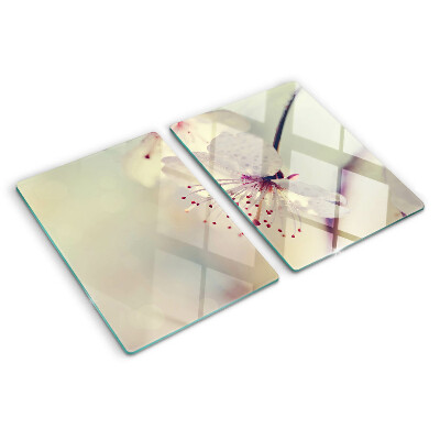 Tagliere in vetro temperato con motivo floreale su sfondo geometrico