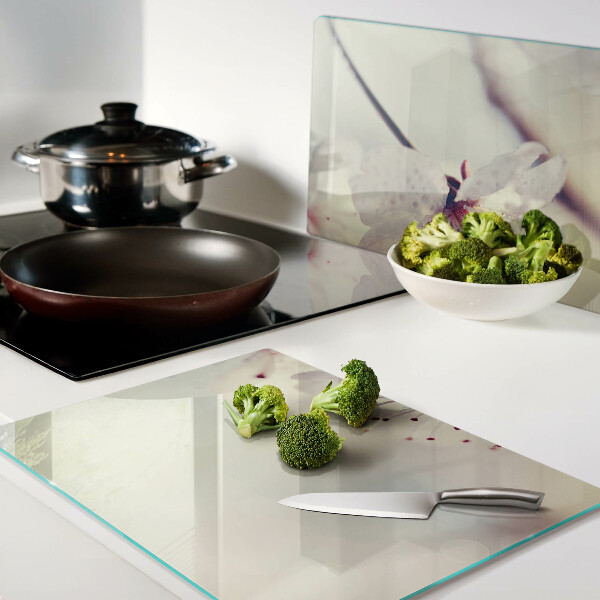 Tagliere in vetro temperato con motivo floreale su sfondo geometrico