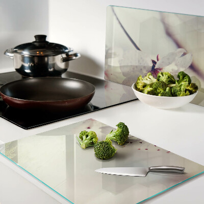 Tagliere in vetro temperato con motivo floreale su sfondo geometrico