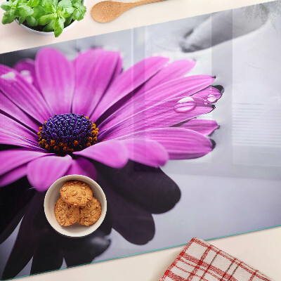 Tagliere in vetro temperato con motivo di fiore viola e gocce d'acqua