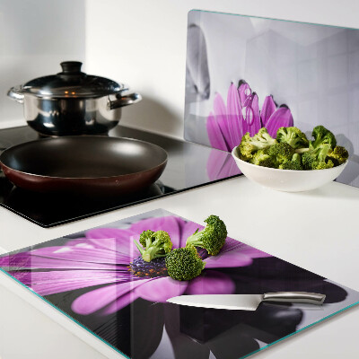 Tagliere in vetro temperato con motivo di fiore viola e gocce d'acqua