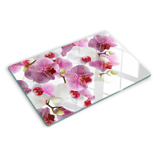 Tagliere in vetro con motivo di orchidee davanti alla finestra