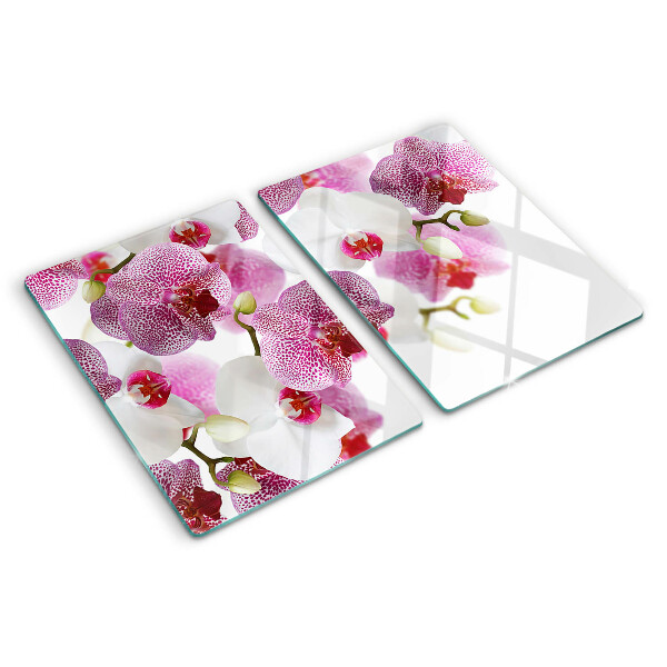 Tagliere in vetro con motivo di orchidee davanti alla finestra