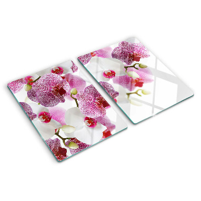 Tagliere in vetro con motivo di orchidee davanti alla finestra