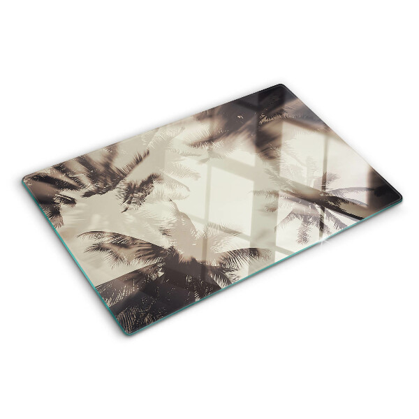 Tagliere in vetro temperato con motivo di palme su sfondo monocromatico