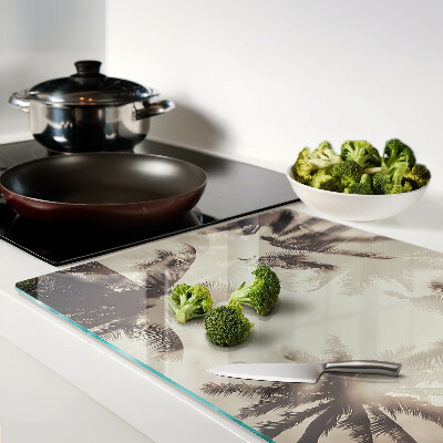 Tagliere in vetro temperato con motivo di palme su sfondo monocromatico