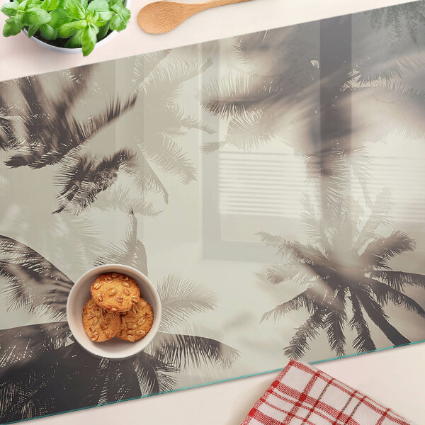 Tagliere in vetro temperato con motivo di palme su sfondo monocromatico