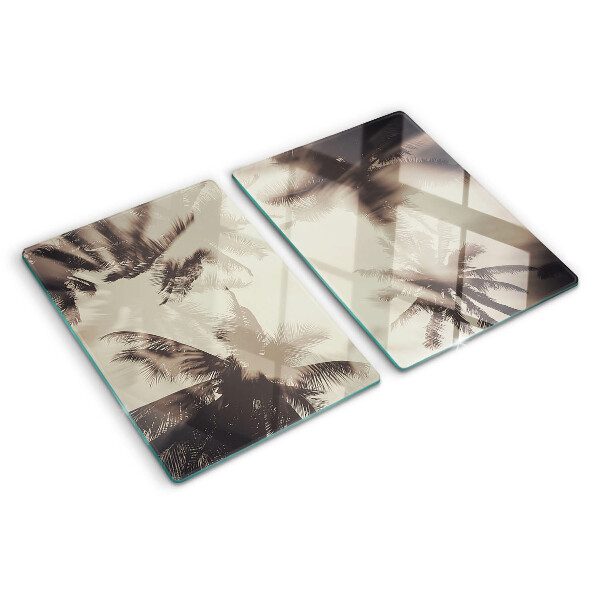Tagliere in vetro temperato con motivo di palme su sfondo monocromatico