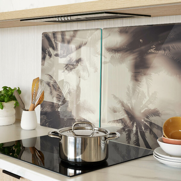 Tagliere in vetro temperato con motivo di palme su sfondo monocromatico