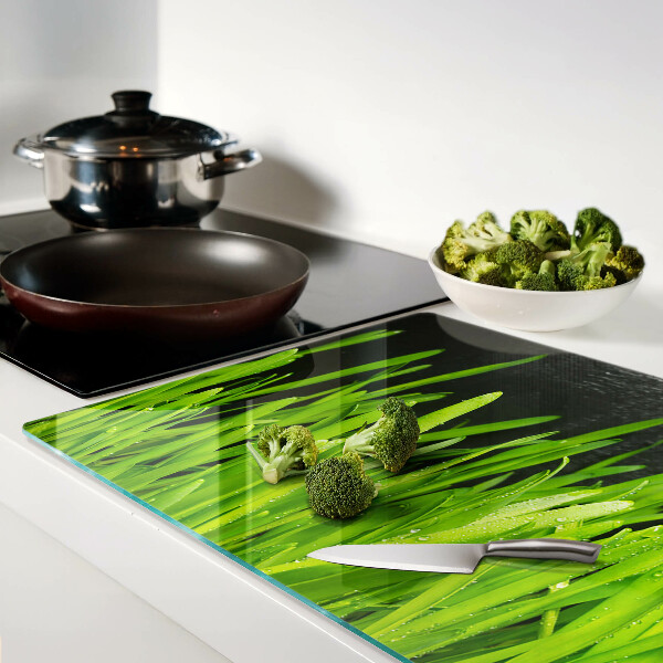 Tagliere in vetro temperato con motivo di erba verde con gocce d'acqua