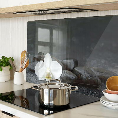 Tagliere in vetro temperato con motivo a fiore di orchidea su pietre