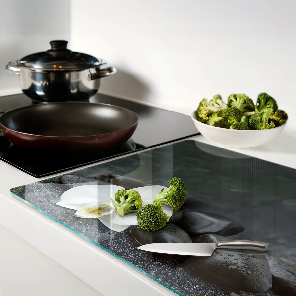 Tagliere in vetro temperato con motivo a fiore di orchidea su pietre